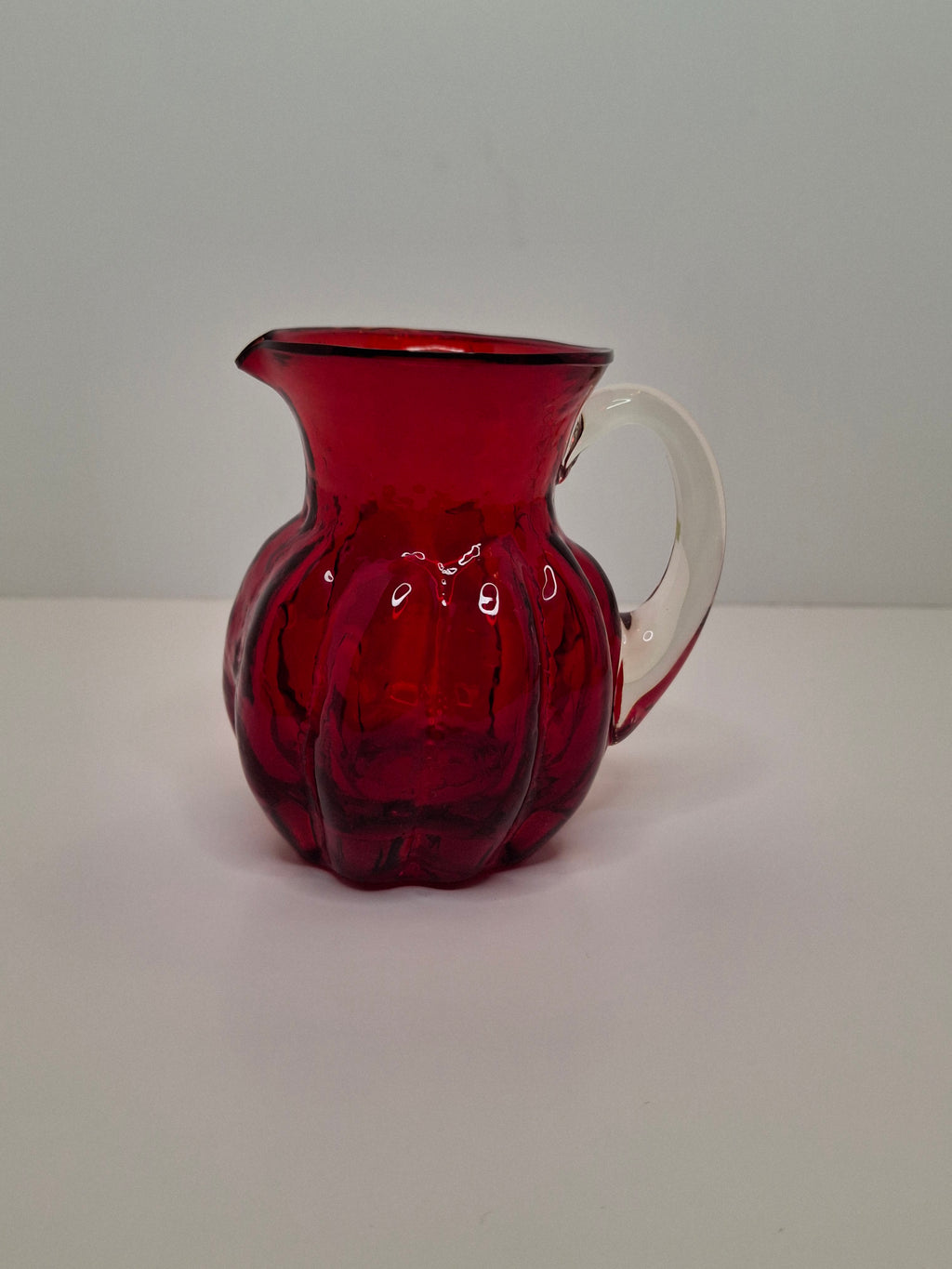 Circa late 1800s to 1940s Hand-Blown Ruby Red Cranberry Glass Creamer w/ Clear Applied Handle & Pontil