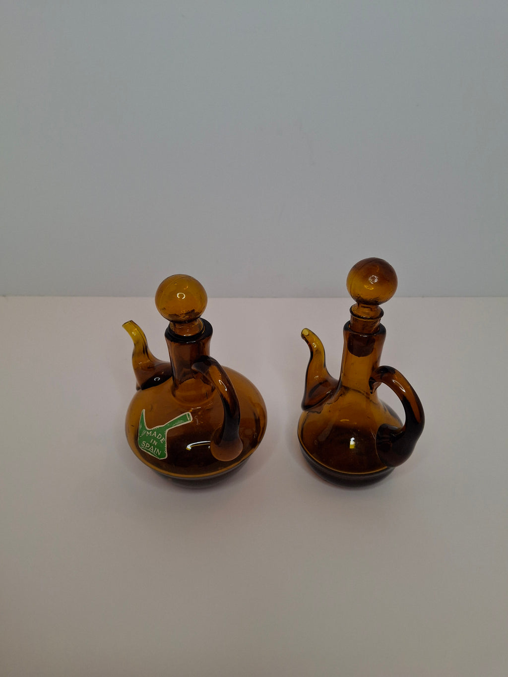 Pair of Hand-Blown Amber Glass Cruets w/ Stoppers, Applied Handle/Spouts Spain