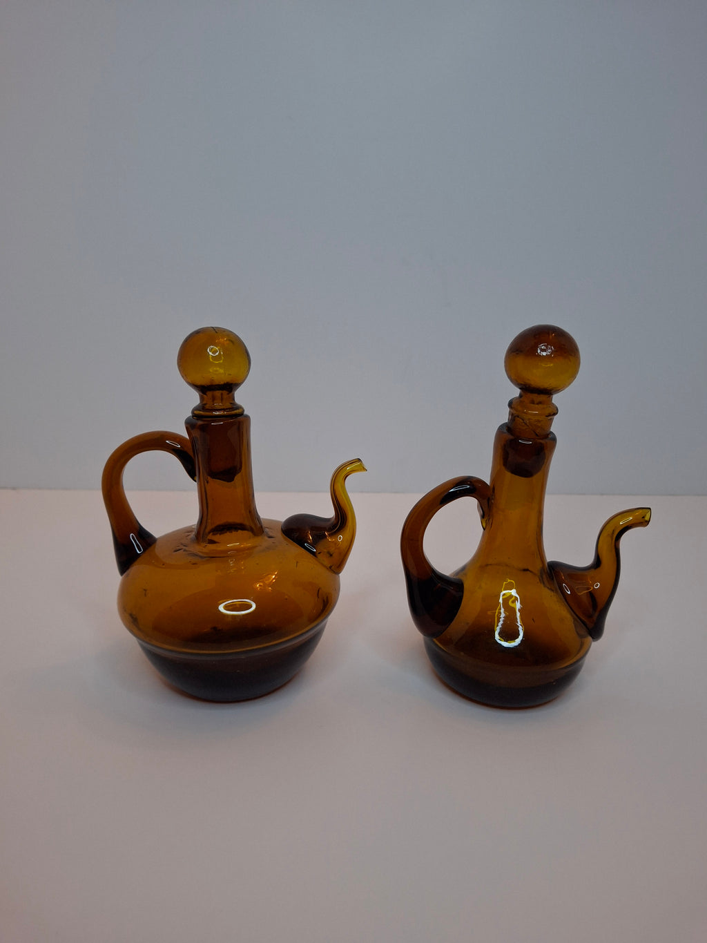 Pair of Hand-Blown Amber Glass Cruets w/ Stoppers, Applied Handle/Spouts Spain