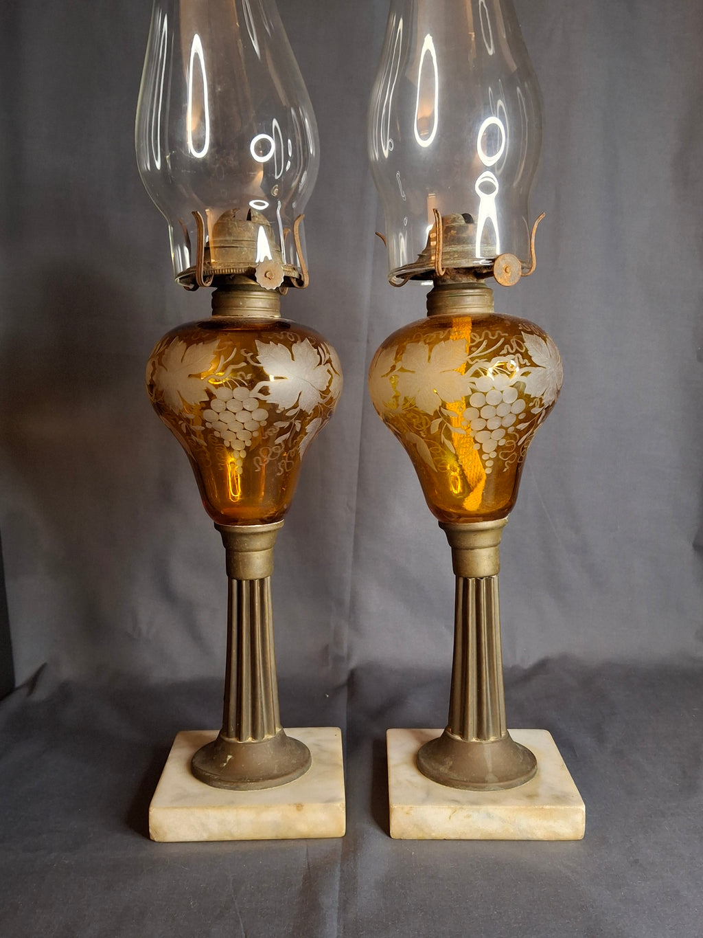 Antique Matching Pair 19th Century Amber Glass Kerosene Lamps Grape Pattern Marble Base