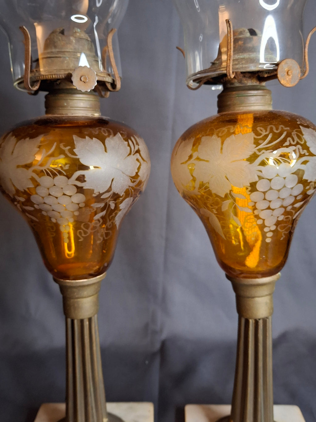 Antique Matching Pair 19th Century Amber Glass Kerosene Lamps Grape Pattern Marble Base