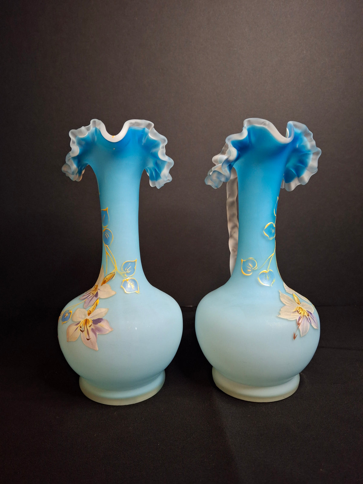 Antique Pair Victorian Blue Satin Cased Glass Pitcher Ewers Hand Painted Orchids Frosted Coral Branch Handles Ruffled Rim