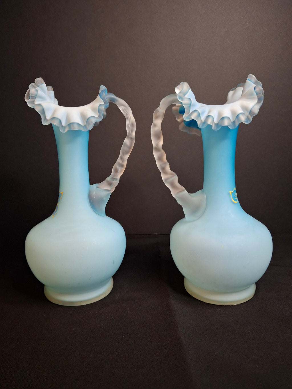 Antique Pair Victorian Blue Satin Cased Glass Pitcher Ewers Hand Painted Orchids Frosted Coral Branch Handles Ruffled Rim