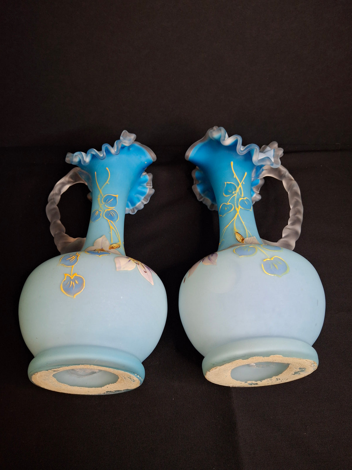 Antique Pair Victorian Blue Satin Cased Glass Pitcher Ewers Hand Painted Orchids Frosted Coral Branch Handles Ruffled Rim