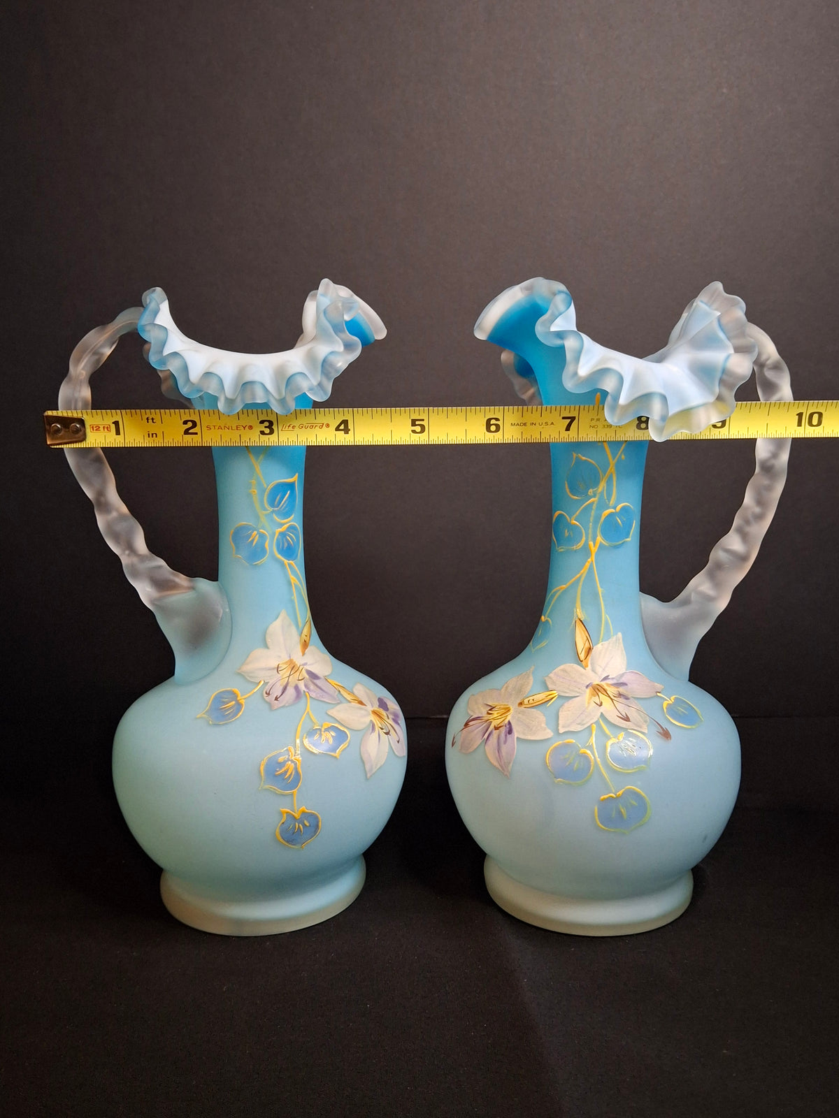Antique Pair Victorian Blue Satin Cased Glass Pitcher Ewers Hand Painted Orchids Frosted Coral Branch Handles Ruffled Rim