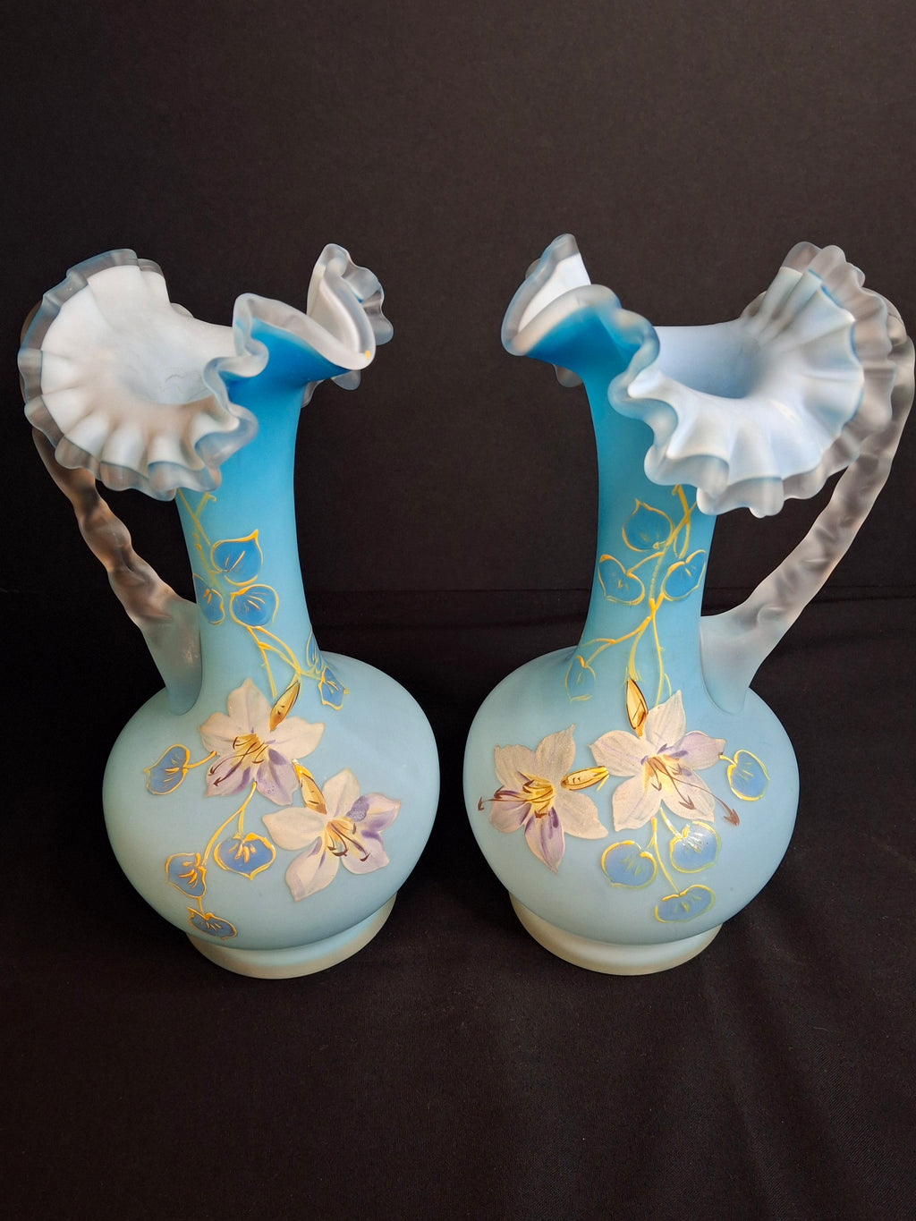 Antique Pair Victorian Blue Satin Cased Glass Pitcher Ewers Hand Painted Orchids Frosted Coral Branch Handles Ruffled Rim