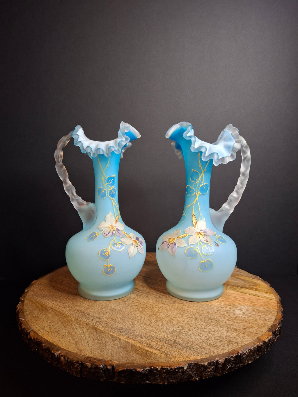 Antique Pair Victorian Blue Satin Cased Glass Pitcher Ewers Hand Painted Orchids Frosted Coral Branch Handles Ruffled Rim