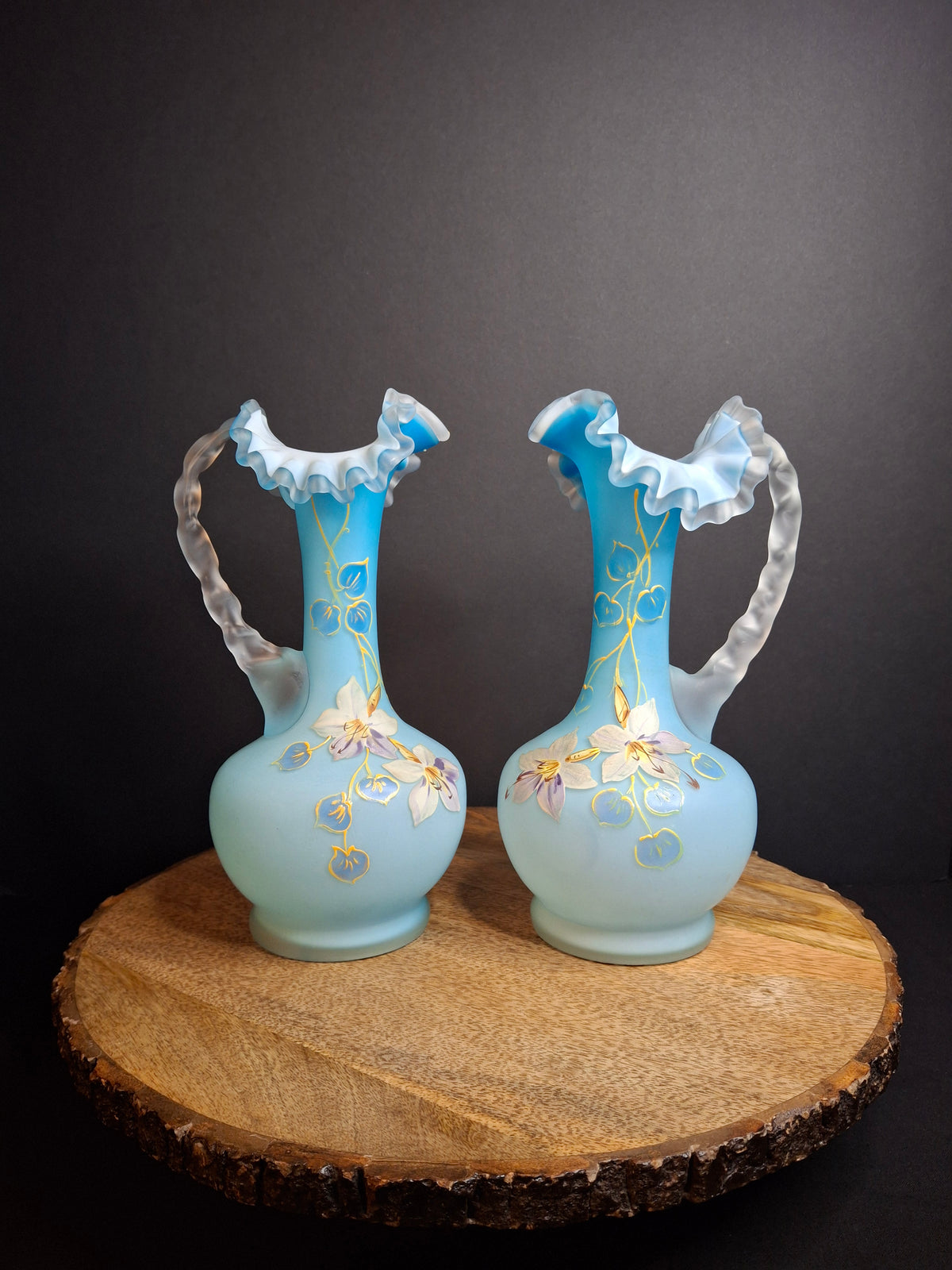 Antique Pair Victorian Blue Satin Cased Glass Pitcher Ewers Hand Painted Orchids Frosted Coral Branch Handles Ruffled Rim